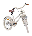 Beigefarbenes Fahrrad von vorne rechts