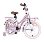 Rosa Kinderfahrrad mit Stützrädern in der Seitenansicht