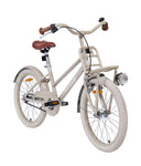 Beigefarbenes Fahrrad von vorne links