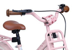 Rosa Kinderfahrrad mit braunen Lenkergriffen